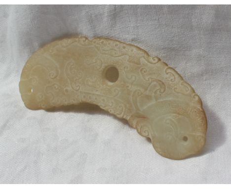 Property of a Viscount: A carved jade pendant of semi circular form pierced with three holes and decorated with clouds, 11.5c