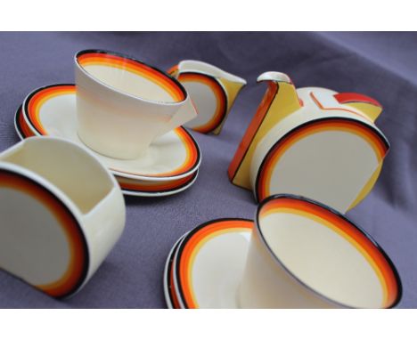 A Clarice Cliff Stamford shape bachelors tea set, decorated in concentric circles of yellow, orange and black, comprising a t