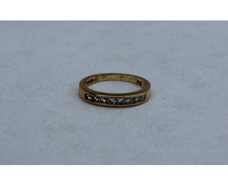 An eight stone diamond ring, set with brilliant cut stones to an 18ct yellow gold setting and shank