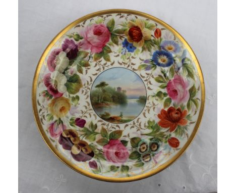 A Swansea porcelain dish of circular form, with a thick gilt rim, the border profusely painted with roses, pansies and other 