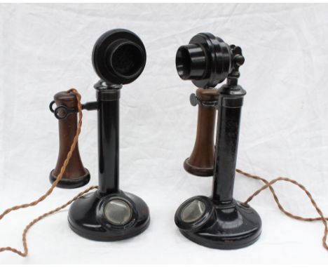 A pair of candlestick telephones No.150, black painted with brass and bakelite horn and mouthpiece, 31.5cm high 
