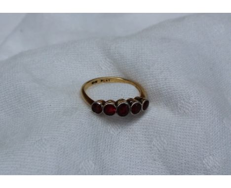 A five stone ruby ring, the graduated rubies to a yellow metal setting and shank marked 18ct & Plat