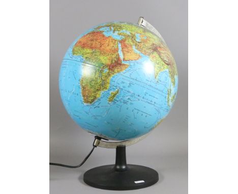 An illuminating globe and stand manufactured in Denmark.
