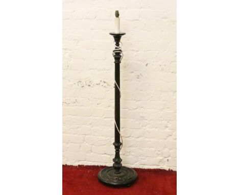 A carved mahogany lamp standard.