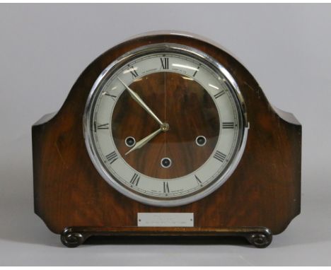 A walnut cased eight day Westminster mantel clock chiming quarterly on a gong.