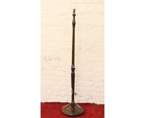A turned oak lamp stand.