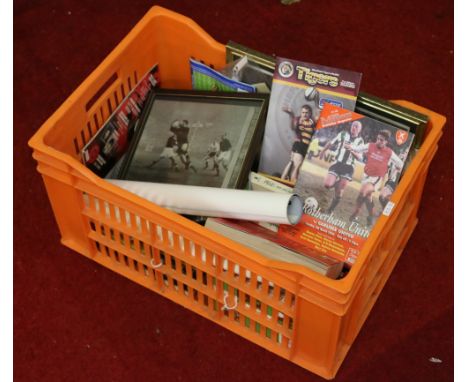 A box of sporting memorabilia to include rugby photograph, boxing posters, various associated books and football programmes.