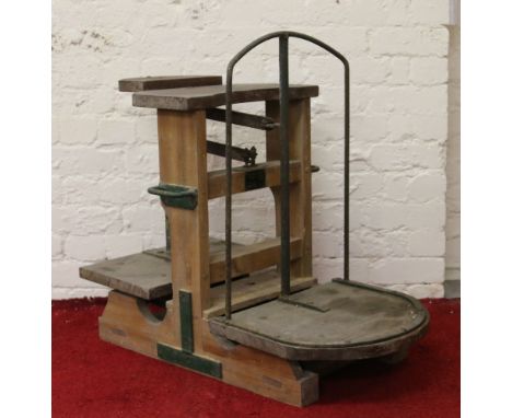 A set of antique wooden and iron potato scales, makers label for E. J. Tong & Sons
