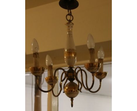 A brass and pottery four branch hanging lamp.