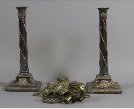 A pair of 19th century Sheffield plate column candlesticks along with oil lamp spares.