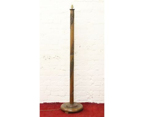 A Chinese carved hardwood standard lamp.