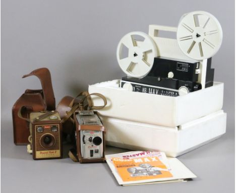 A Cinemax 8mm reel to reel projector along with a Kodak Brownie 8mm movie camera and a Flash B camera.