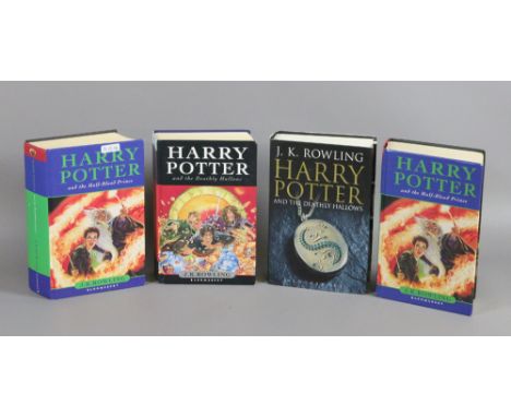 Four first edition Harry Potter hard back books. Harry Potter and The Half Blood Prince and Harry Potter and The Deathly Hall