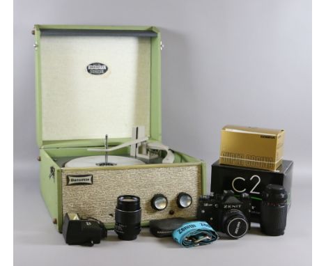 A 1960s Dansette record player and a collection of photographic equipment to include boxed 35mm cameras, lenses, flash gun, l