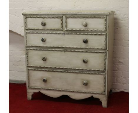 A Georgian painted pine two over three chest of graduated drawers raised on bracket feet.