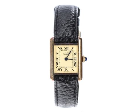 Must de Cartier silver-gilt lady's wristwatch, case no. 311xxxx, champagne dial with secret signature at eleven, cabouchon cr