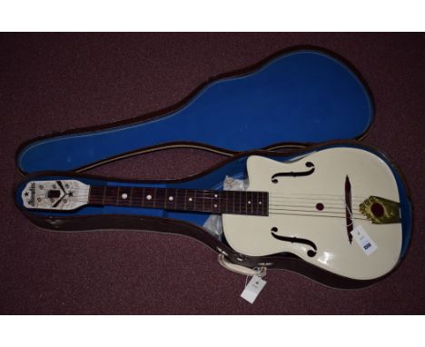 A Macciferri acoustic guitar, G40 Dow Styron, with arch top, whit plastic mounted head and body with wood effect fret board a