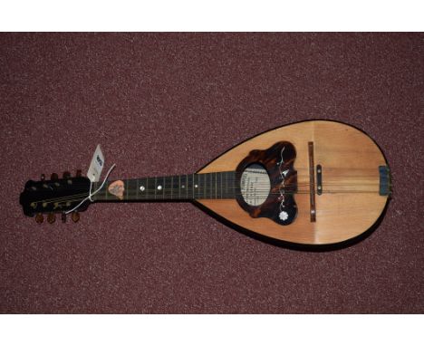 A eight string mandolin by F. Cassaro & G. Rompoli, model 1, serial No.423, circa 1901, 60cms long.