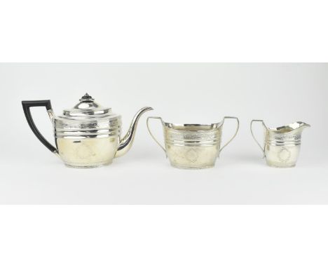 A Georgian Scottish silver three piece tea set by William &amp; Patrick Cunningham, Edinburgh 1802, comprising a teapot, a tw