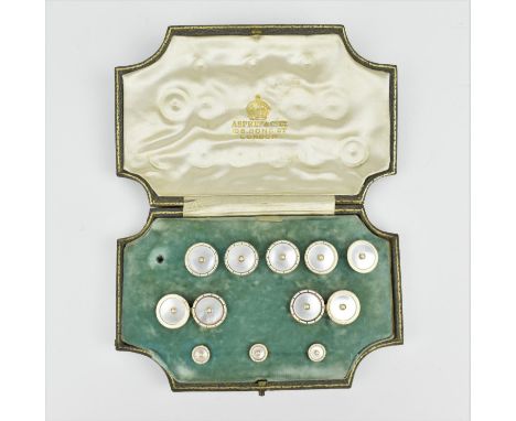A cased set of Asprey shirt studs and cuff links, with mother of pearl, enamel and seed pearls, mounted on 14 ct yellow gold,