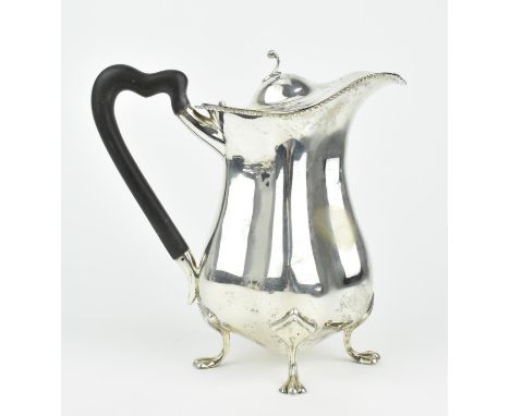 An early 20th century English silver coffee pot by Mappin and Webb, Birmingham 1912, with lobed form body mounted with an ebo