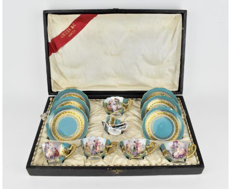A cased set of Vienna painted porcelain cups and saucers, comprising five cups and saucers, with turquoise blue ground and gi