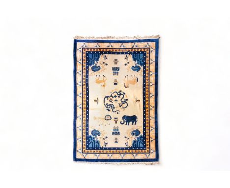 A Chinese woolen 'Beijing' pictorial animal rug with a blue elephant, first quarter of the 20th Century        Decorated with