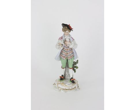A porcelain statue of a gentleman holding a dove, first quarter 20th Century        Passau Dressel und Kister, marked and num