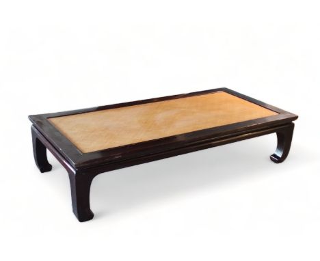 A Chinese black lacquered rectangular daybed, 19th/20th Century        The panelled top with cane inset above a waisted friez