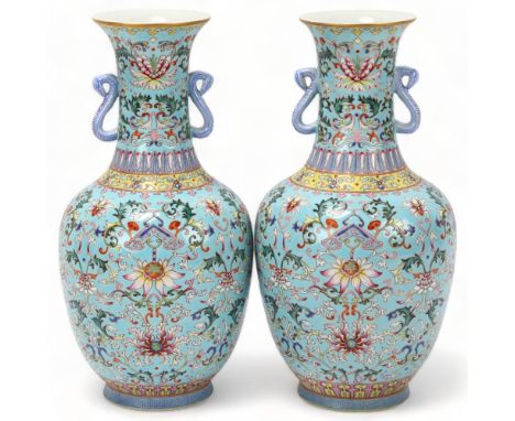 Pair of Chinese pale blue glaze porcelain vases with rui design handles, allover painted enamel floral decoration, seal mark 