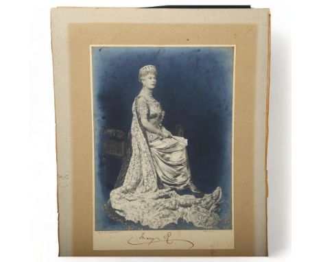HRH Queen Mary Of Teck (1867 - 1953), studio photograph, signed in ink below the image, image size 28cm x 21cm, unframedPhoto