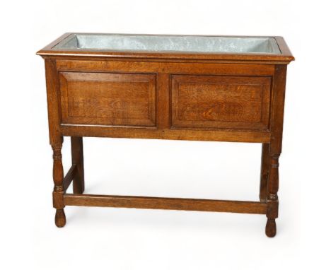 A Victorian Oak planter with original zinc liner, height 76cm, 97x 43cmGood condition, zinc liner has deteriorated and has a 