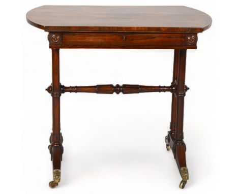 A small Victorian rosewood writing table in the manner of Gillows, with frieze drawer and stretcher base, length 76cm, depth 