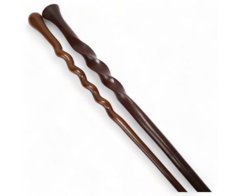 An African hardwood spiral twist ceremonial staff, and a similar hardwood twist design stick (2)The thinner stick has slight 