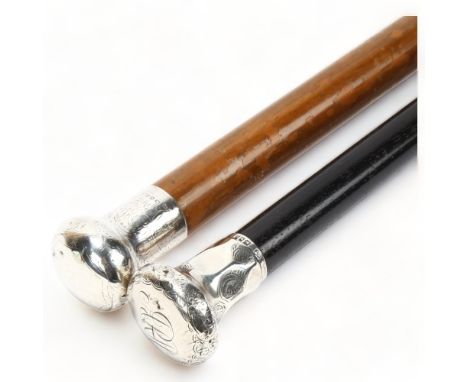 An ebony silver-topped walking cane, stamped HT 1923, and a Malacca and silver walking cane, stamped JW 1919 (2)Both canes ha