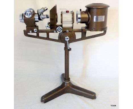 A Flatters and Garnett ltd microscope projector dated 1930