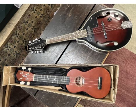 Mandoline handmade by Stagg together with handmade ukulele by Stagg 