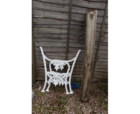 2 cast iron bench ends together with wooden slats ready for assembly 