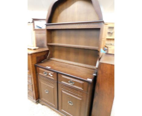 MID-20TH CENTURY OAK FRAMED ARCH TOP DRESSER, THE TOP WITH TWO FIXED SHELVES, THE BASE WITH TWO DRAWERS OVER TWO CUPBOARD DOO