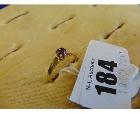 An 18ct Gold and Ruby dress ring, size O