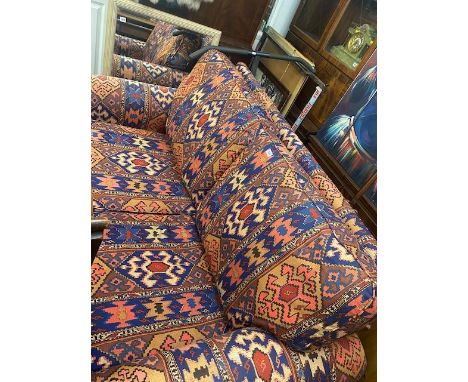 A red/ blue two seater sofa