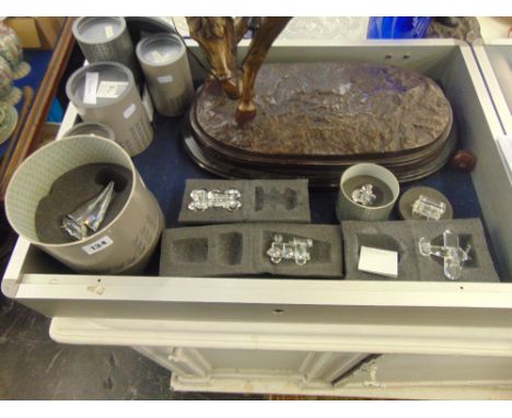 A collection of Swarovski boxed; sailboat, racing car, Aeroplane, engine, carriage and coal tender