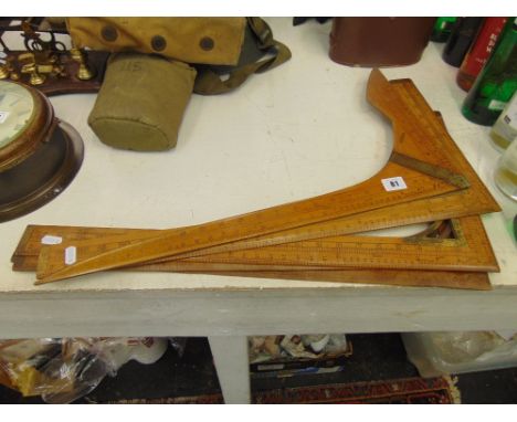A collection of five antique tailors squares inc. J. Rabone and Sons model 1513