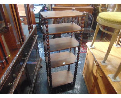 A mahogany five tier bobbin twist whatnot