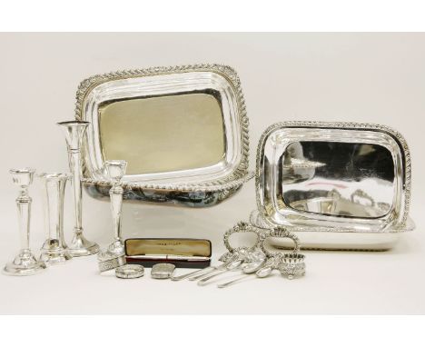 A miscellaneous group of silver: a pair of candlesticks, two vases, two napkin rings, a vesta case, a salt, three spoons, and