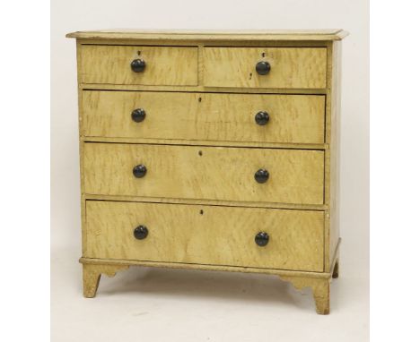 A 19th century painted pine chest of drawers, with two short and three long drawers, on bracket feet and with all-over 'grain