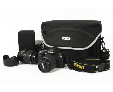 A Nikon D40 digital camera, together with an additional lens, charger, battery, SD card, and Nikon padded case