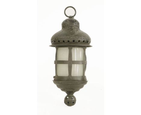 A patinated metal lantern, embossed with a hinged base revealing a candle sconce, converted to electricity, 59cm high