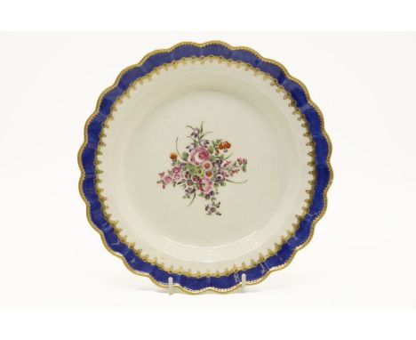 A Worcester Dr Wall period porcelain plate, decorated with a central floral spray