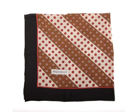 Yves Saint Laurent, a vintage scarf, featuring a red, brown and cream floral design, with a black surrounding border, measuri